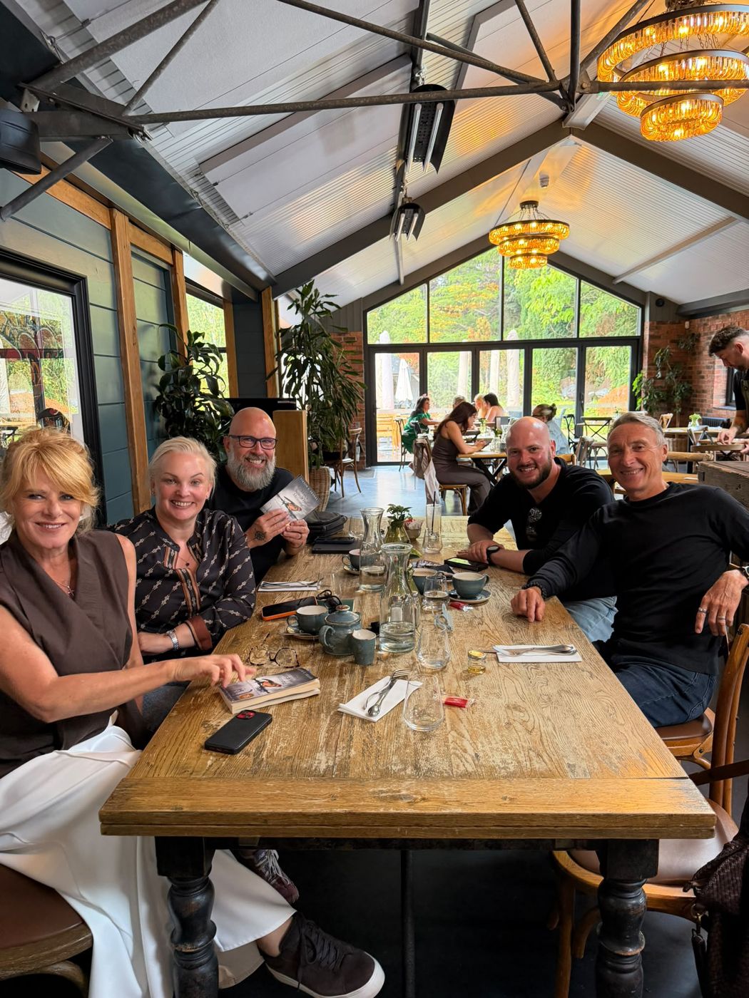 Members around the table with Man's Search for Meaning